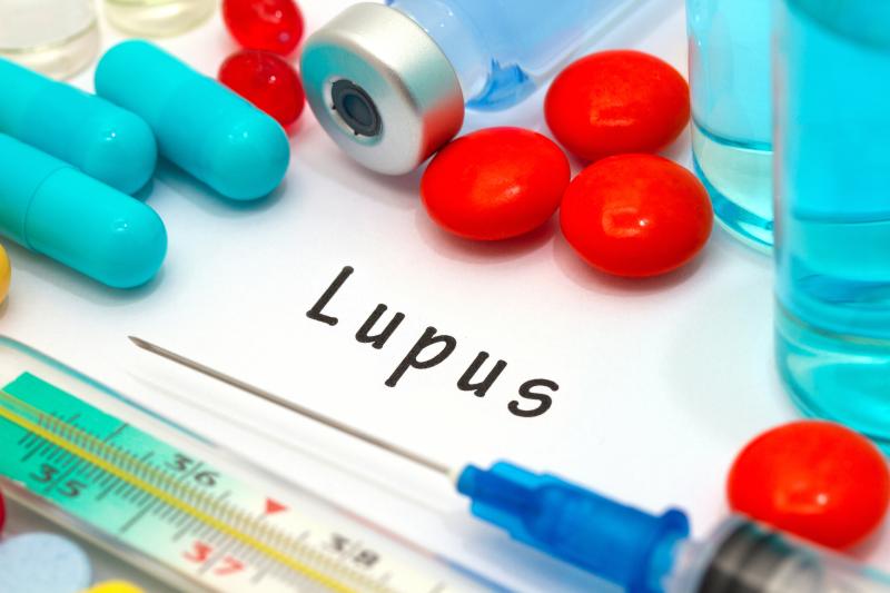 Which factors predict progression from discoid lupus to severe SLE?
